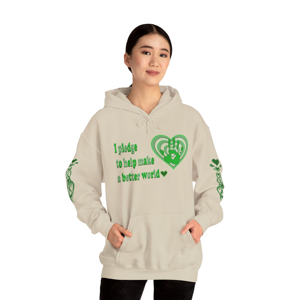 Person wearing a beige hoodie with green text and green heart design