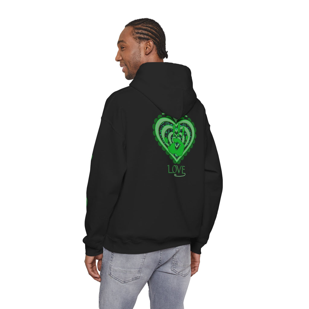 Person wearing a black hoodie with a green heart design on the back, standing against a white background.