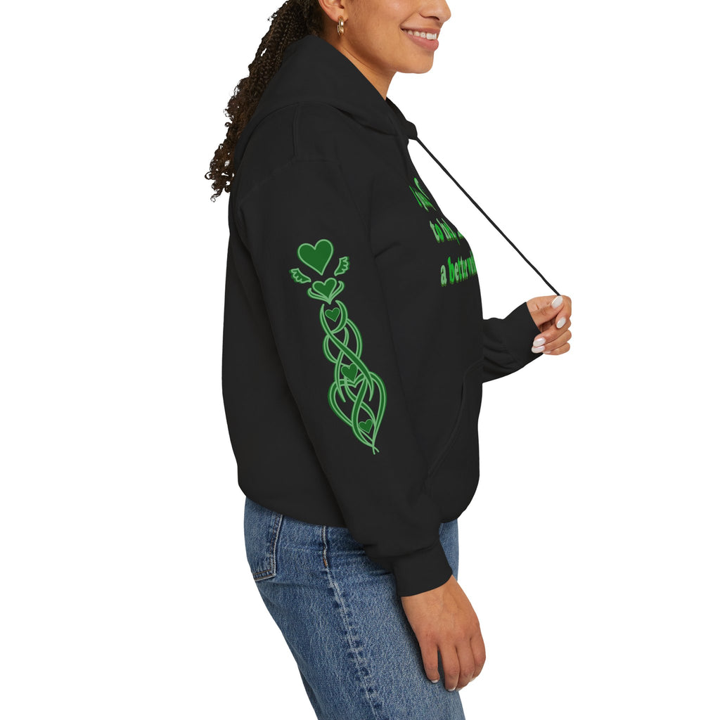 Person wearing a black hoodie with green designs