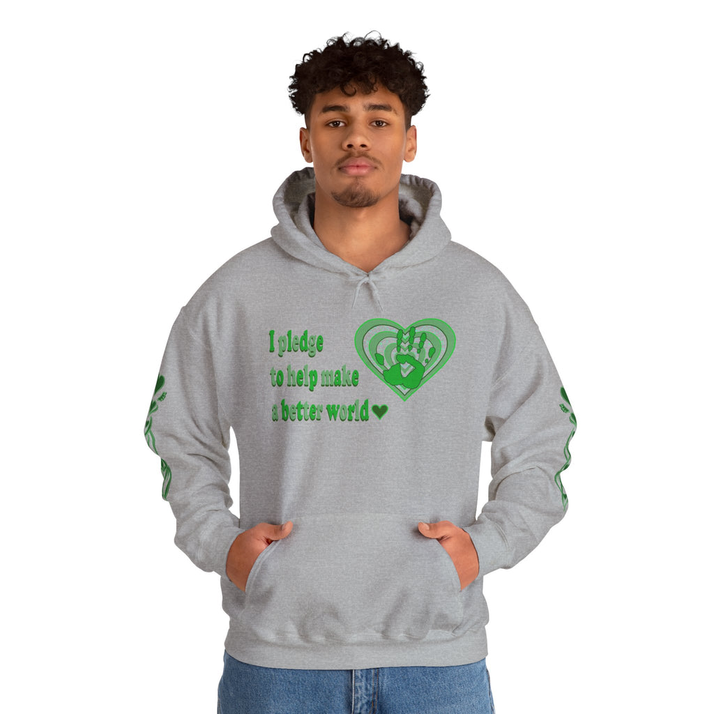 Person wearing a grey hoodie with green text and heart design