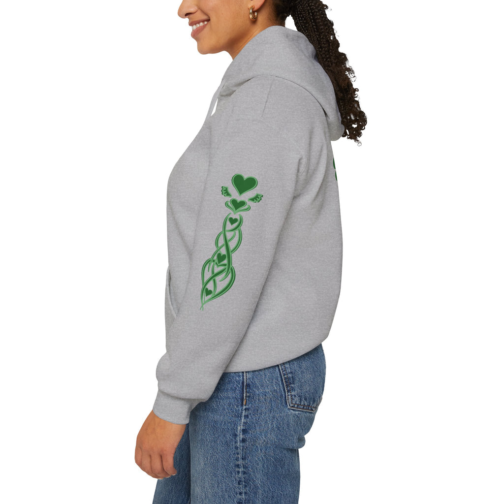 Person wearing a gray hoodie with green designs