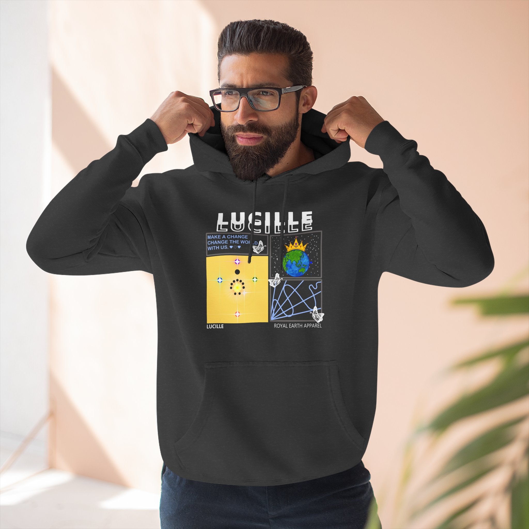 Man wearing a charcoal heather hoodie with a Lucille graphic design and text