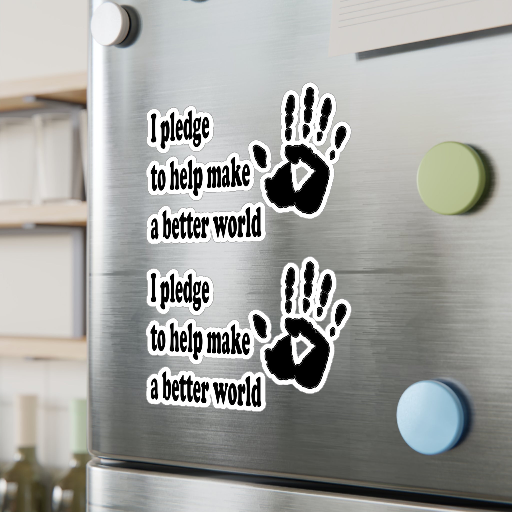 Handprint decals with text that reads 'I pledge to help make a better world' on a metallic surface
