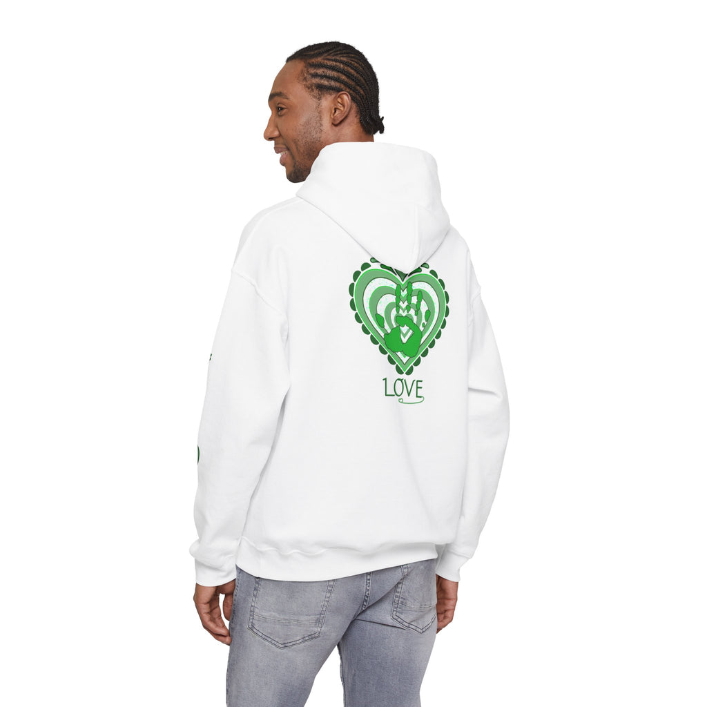 Person wearing a white hoodie with a colorful mountain design on the back, standing against a white background.