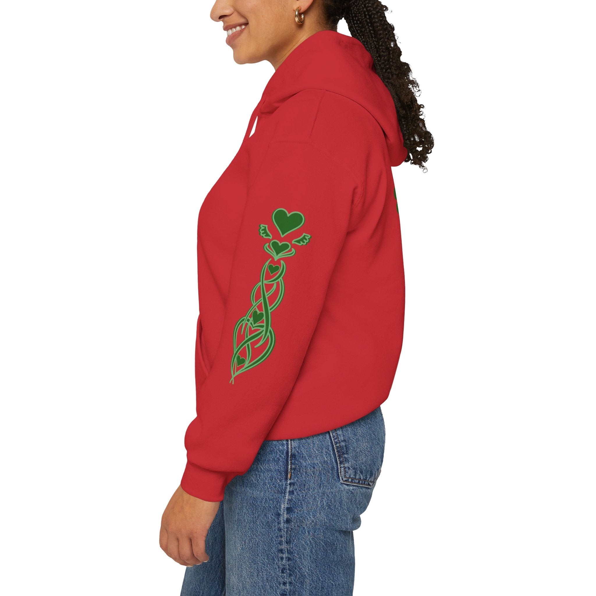 Person wearing a red hoodie with a green design on the back, standing against a white background