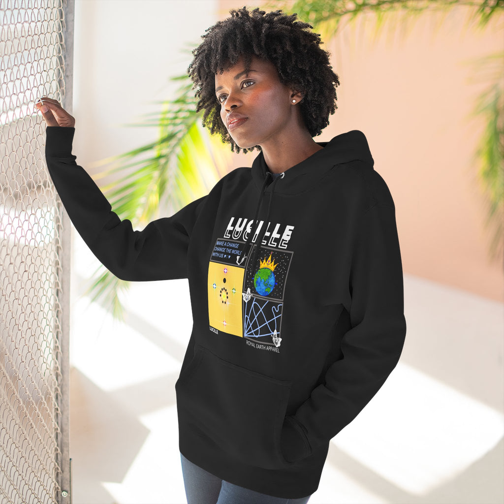 Woman wearing a black hoodie with a graphic Lucille design, standing against a light background.