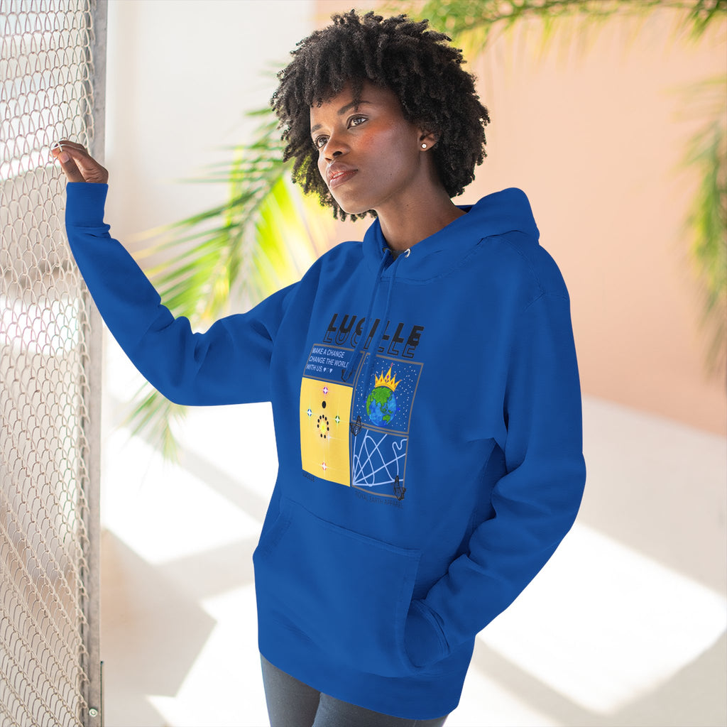 Person wearing a royal blue hoodie with a Lucille graphic design, standing indoors with plants in the background